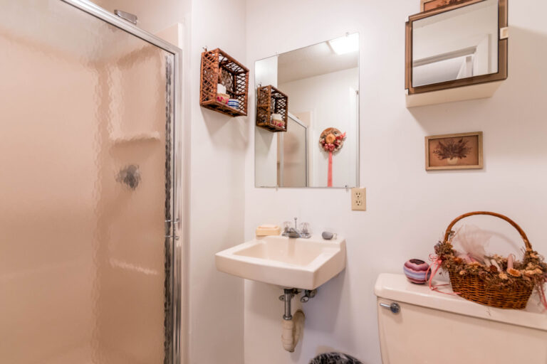a bathroom with shower, lavatory and toilet