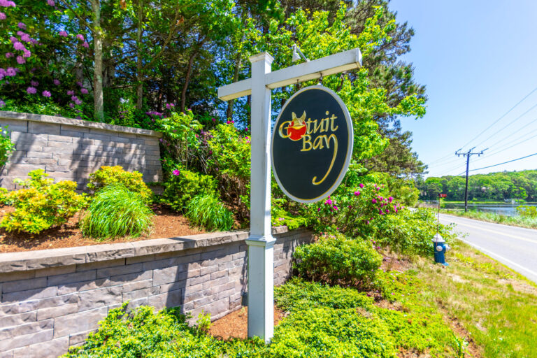 a signage of Cotuit Bay community