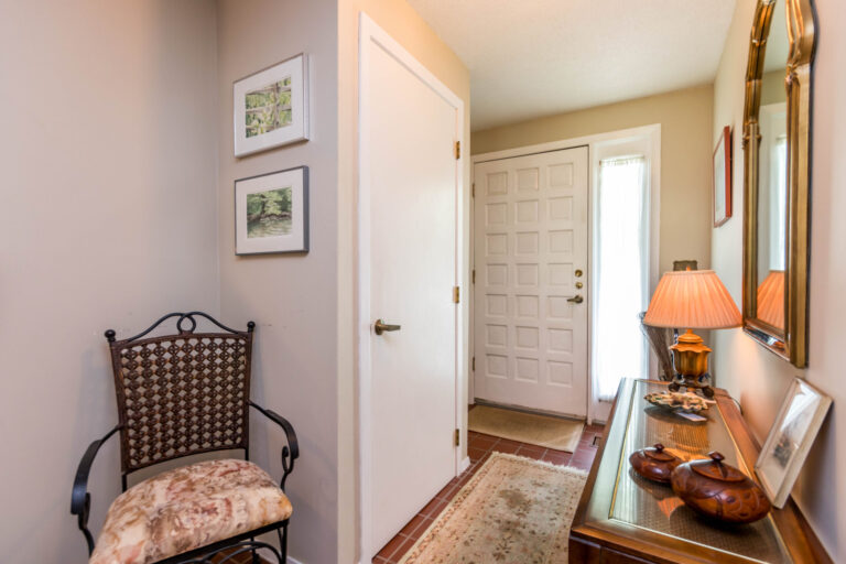a view of the front door in the foyer of a house