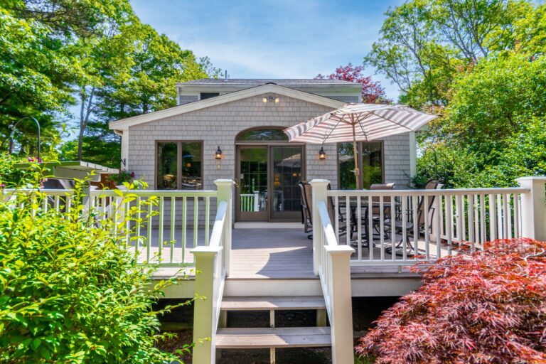 an entry way to the deck and a glass door to the house