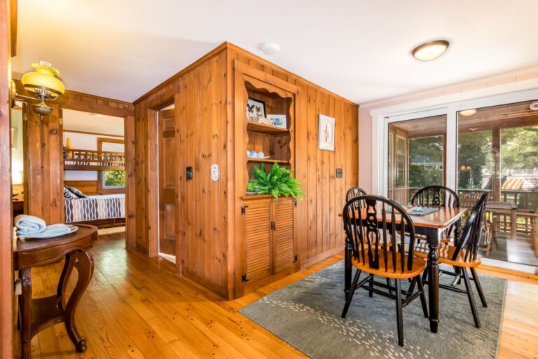 a dining room with wooden tables and chairs