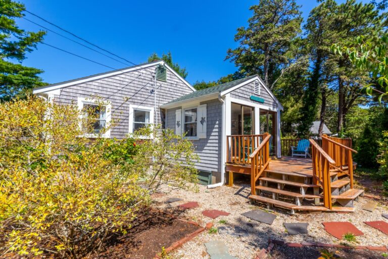 a wooden deck with a strairway entrance