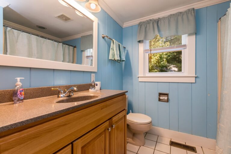 a bathroom with toilet, tub, and lavatory