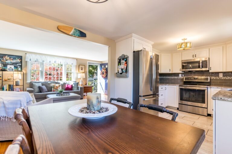 a wooden dining table near the kitchen