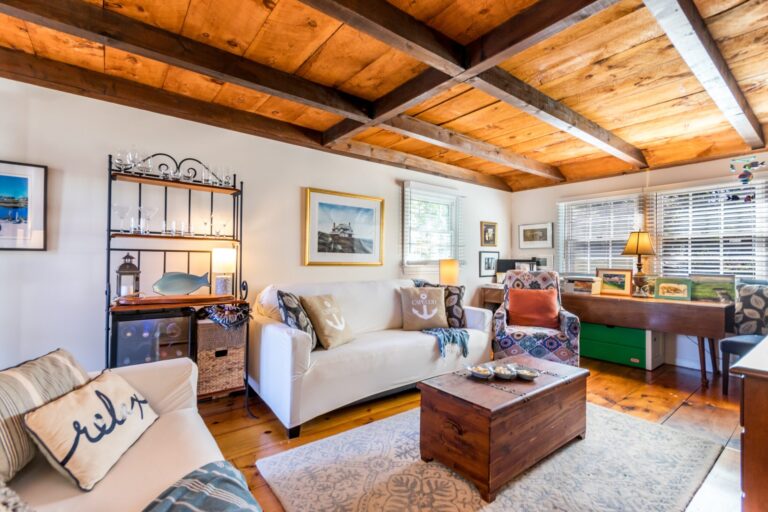 a family room with couch and furnitures