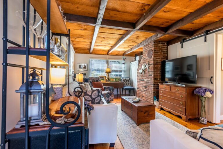 a family room with couch and furnitures