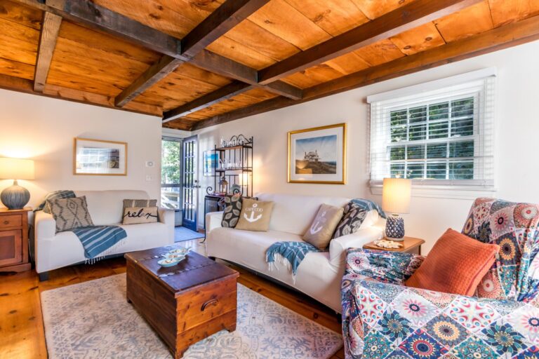 a family room with couch and furnitures