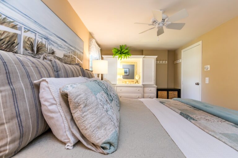 a bedroom with a bed with blue blanket