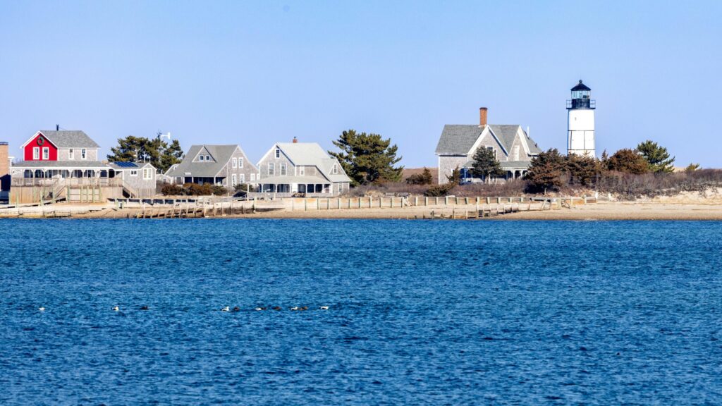 scenic view of lighthouse by the sea in Cape Cod