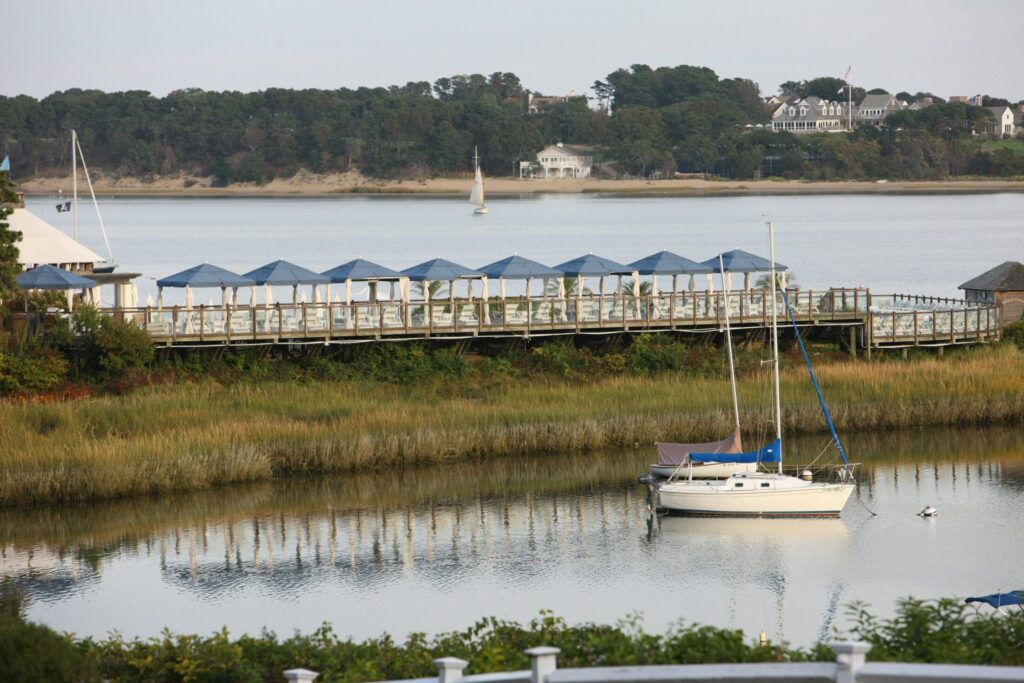 a boat docked in the water near a pier