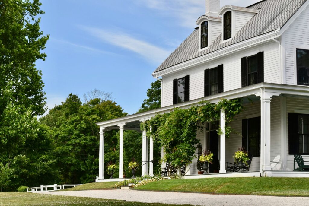 a large white house with columns and a porch