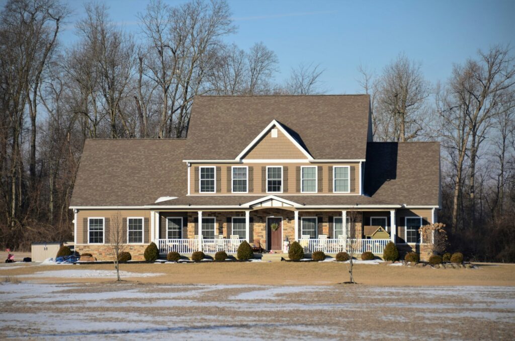 a large house with a lot of snow on the ground